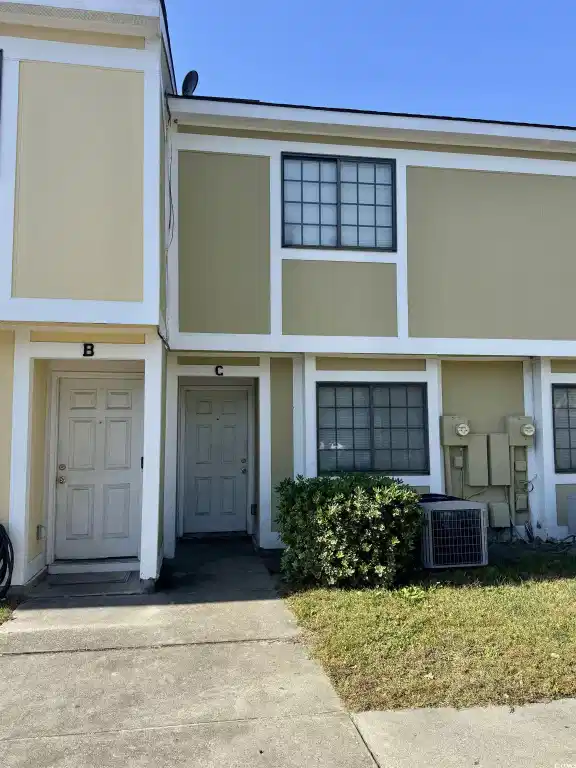 Image 1: View of front of home featuring stucco siding