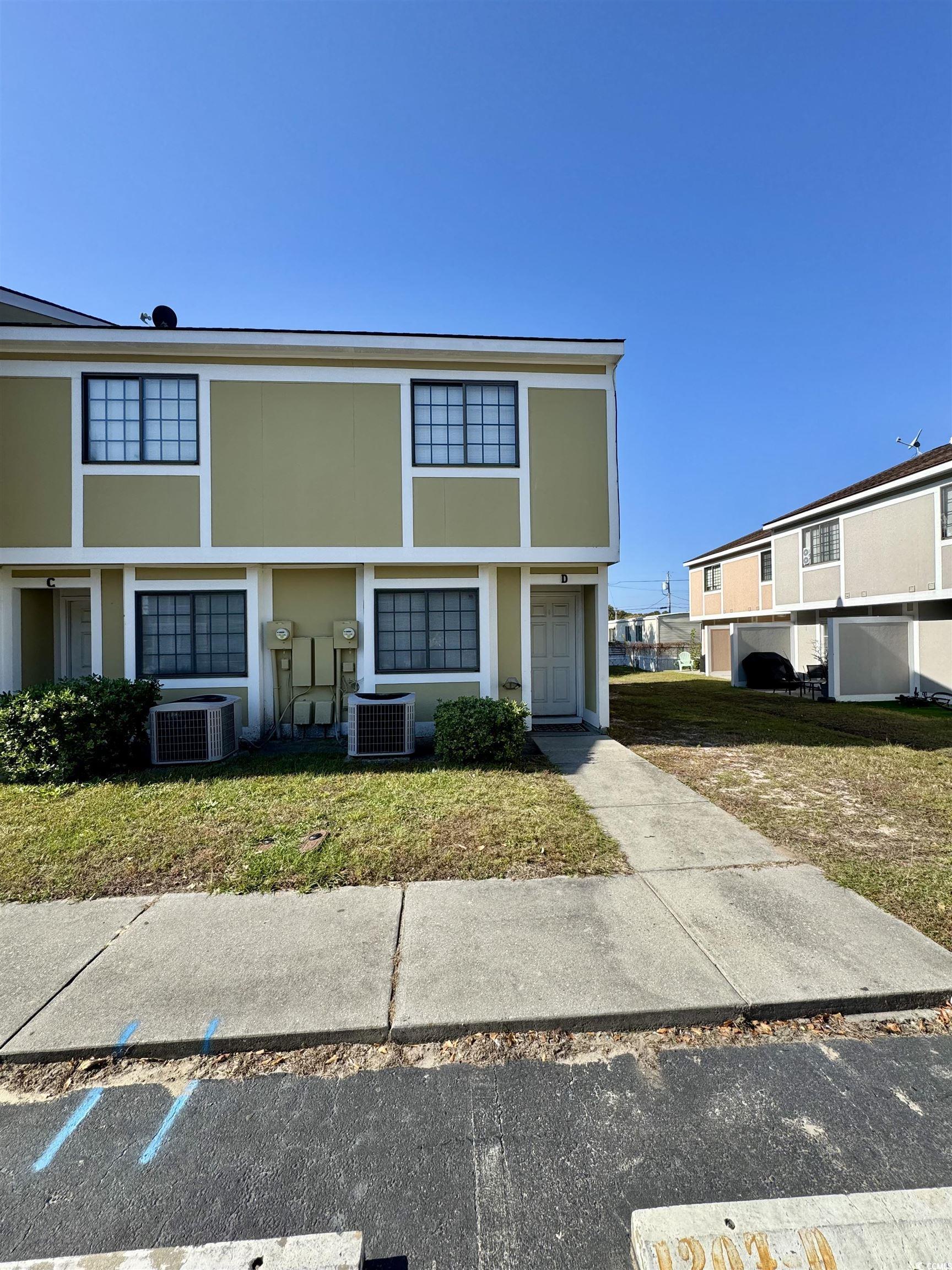 Image 4: View of front of house featuring stucco siding and Image 4: View of front of house featuring stucco siding and