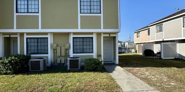 Image 4: View of front of house featuring stucco siding and