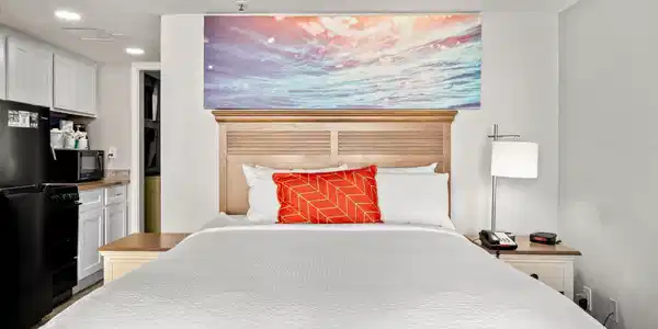 Image 4: Bedroom featuring freestanding refrigerator and re