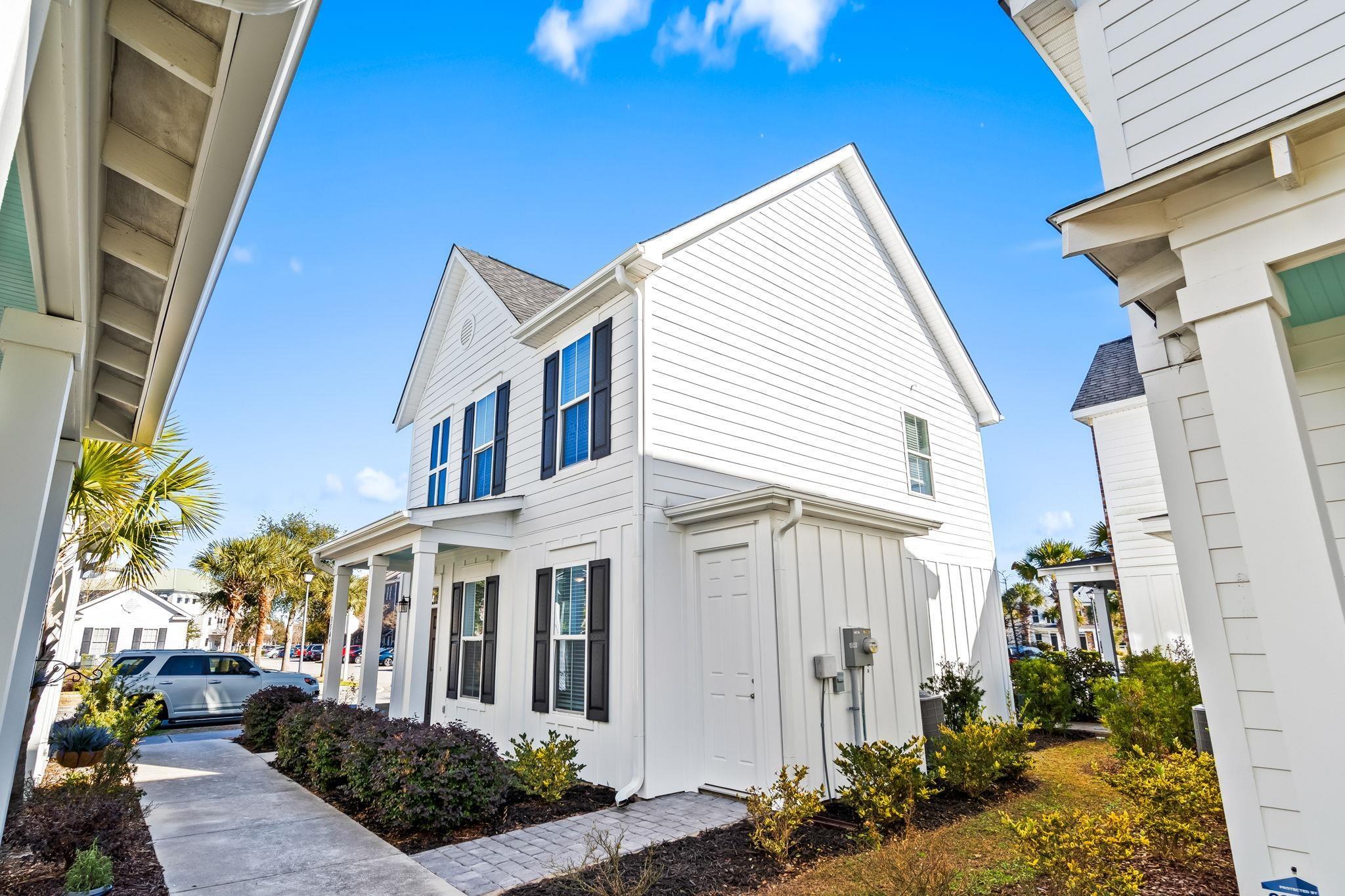Image 3: View of side of property featuring board and batte Image 3: View of side of property featuring board and batte