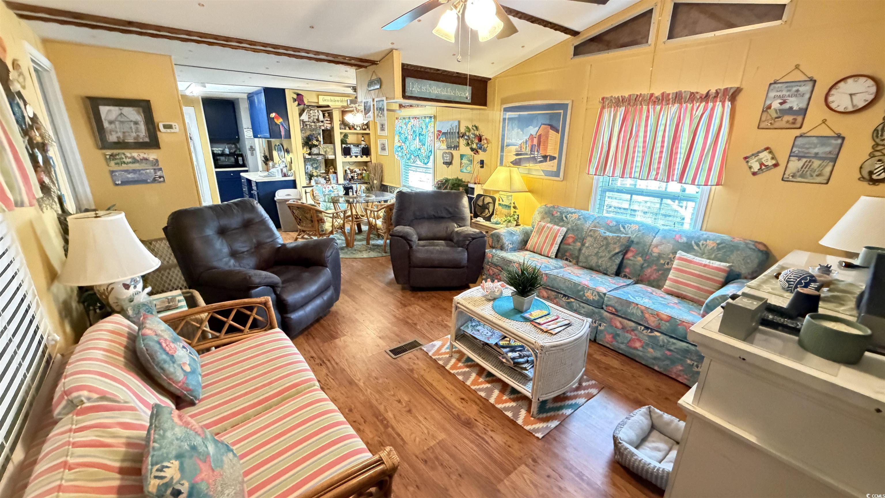 Image 2: Living room featuring vaulted ceiling, wood finish Image 2: Living room featuring vaulted ceiling, wood finish