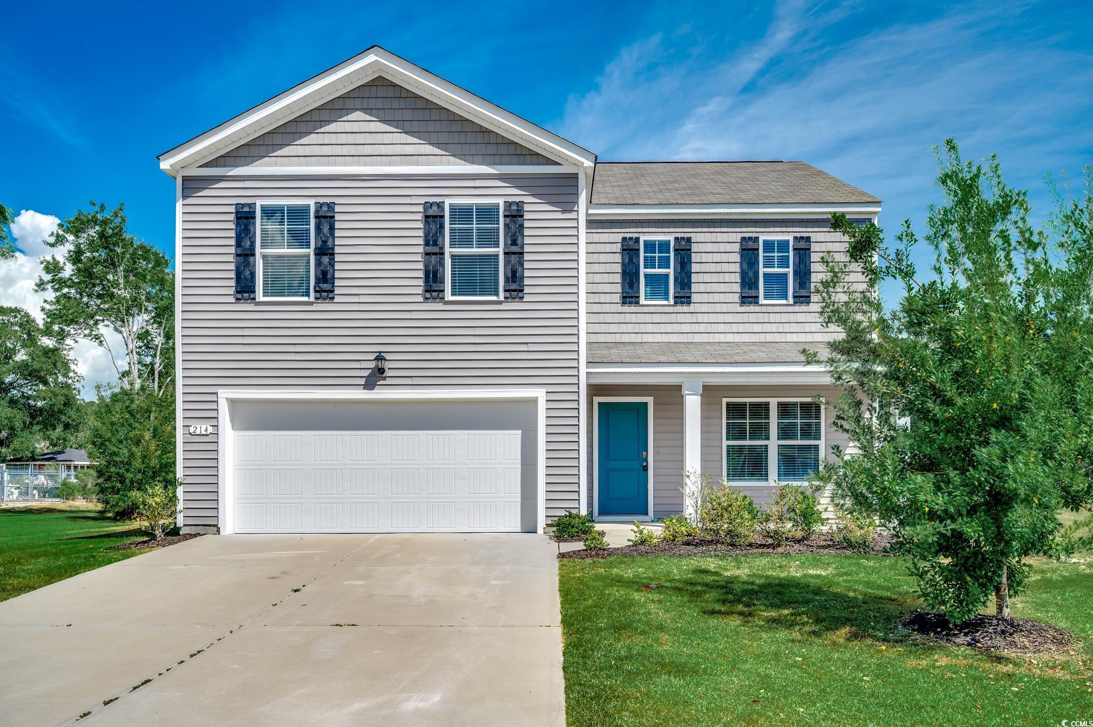 Image 1: View of front of house with concrete driveway, an Image 1: View of front of house with concrete driveway, an