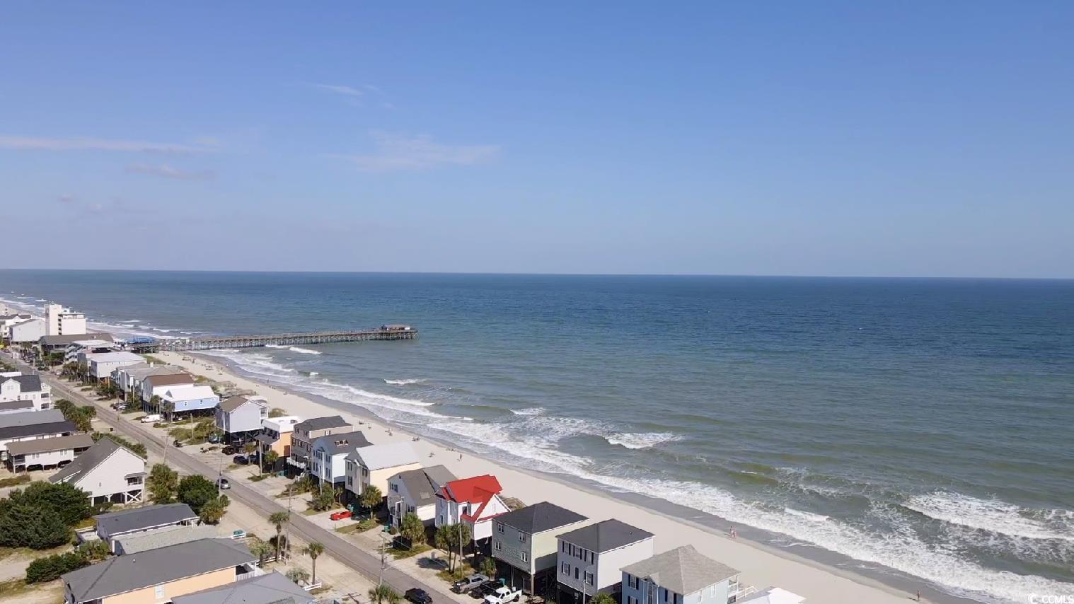 Image 3: Water view featuring local beach and nearby suburb