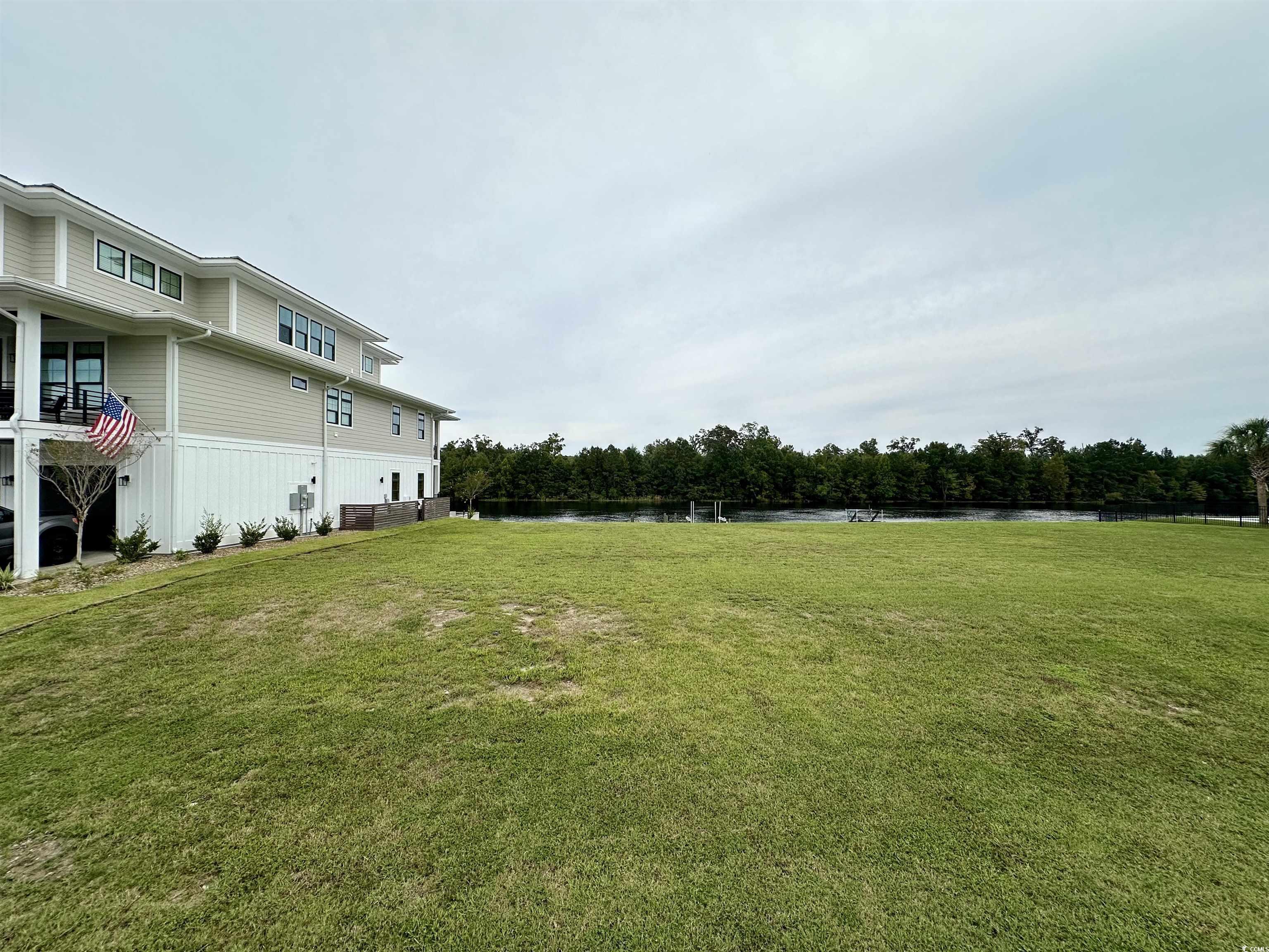 Image 2: View of yard with a water view