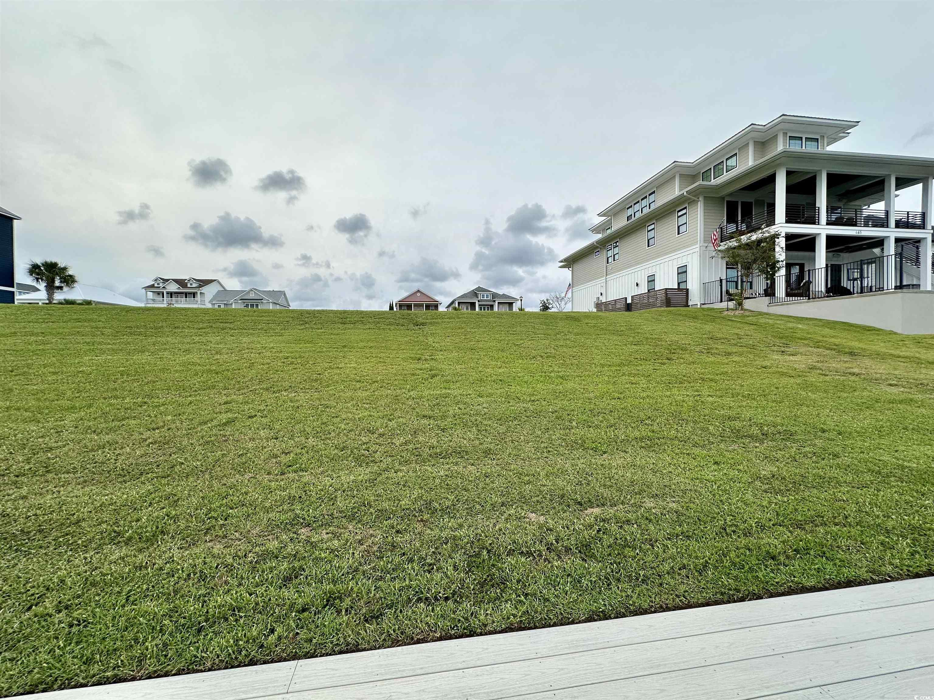 Image 4: View of yard featuring a balcony