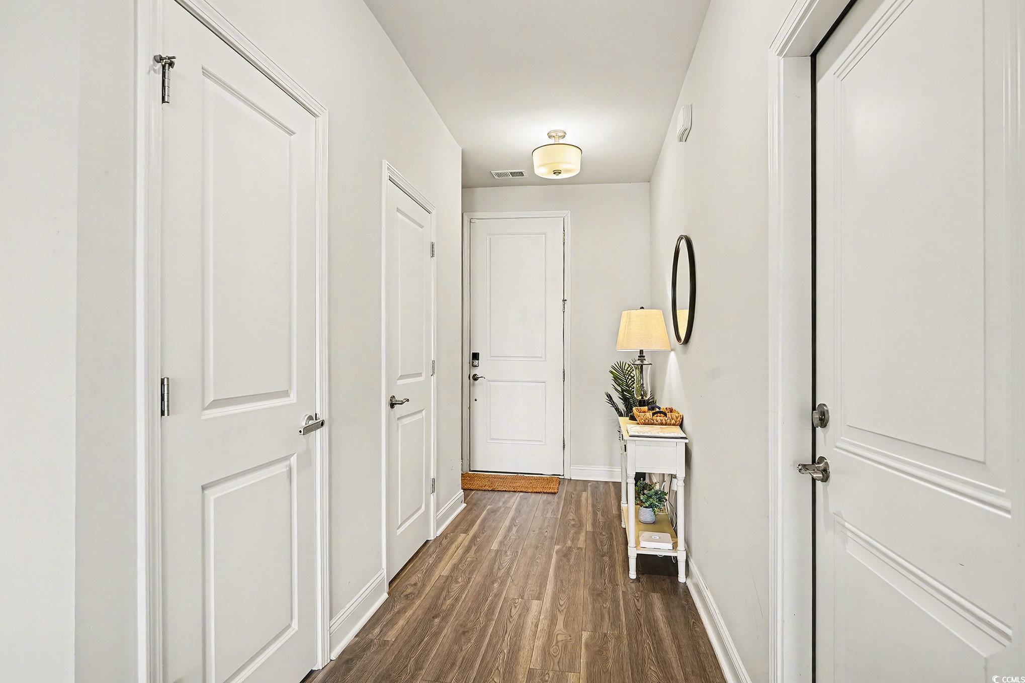 Image 2: Hallway with dark wood-style floors and baseboards Image 2: Hallway with dark wood-style floors and baseboards