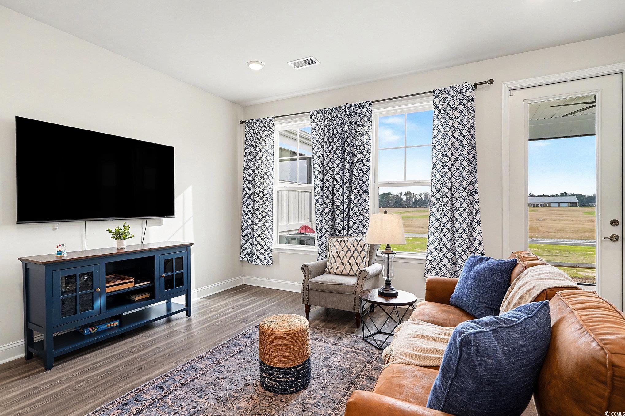 Image 4: Living room featuring wood finished floors and rec Image 4: Living room featuring wood finished floors and rec