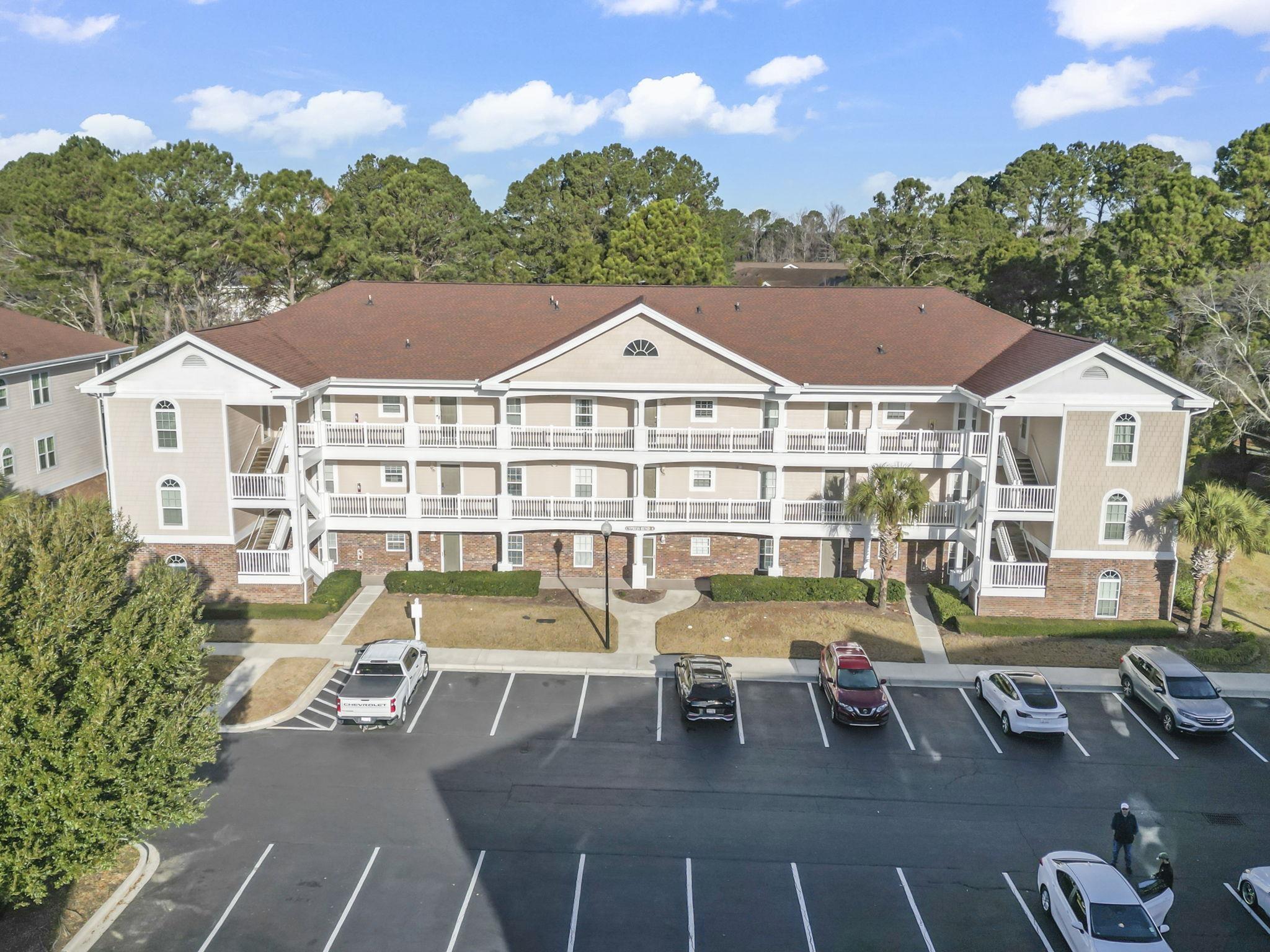 Image 1: View of apartment building / complex featuring unc Image 1: View of apartment building / complex featuring unc