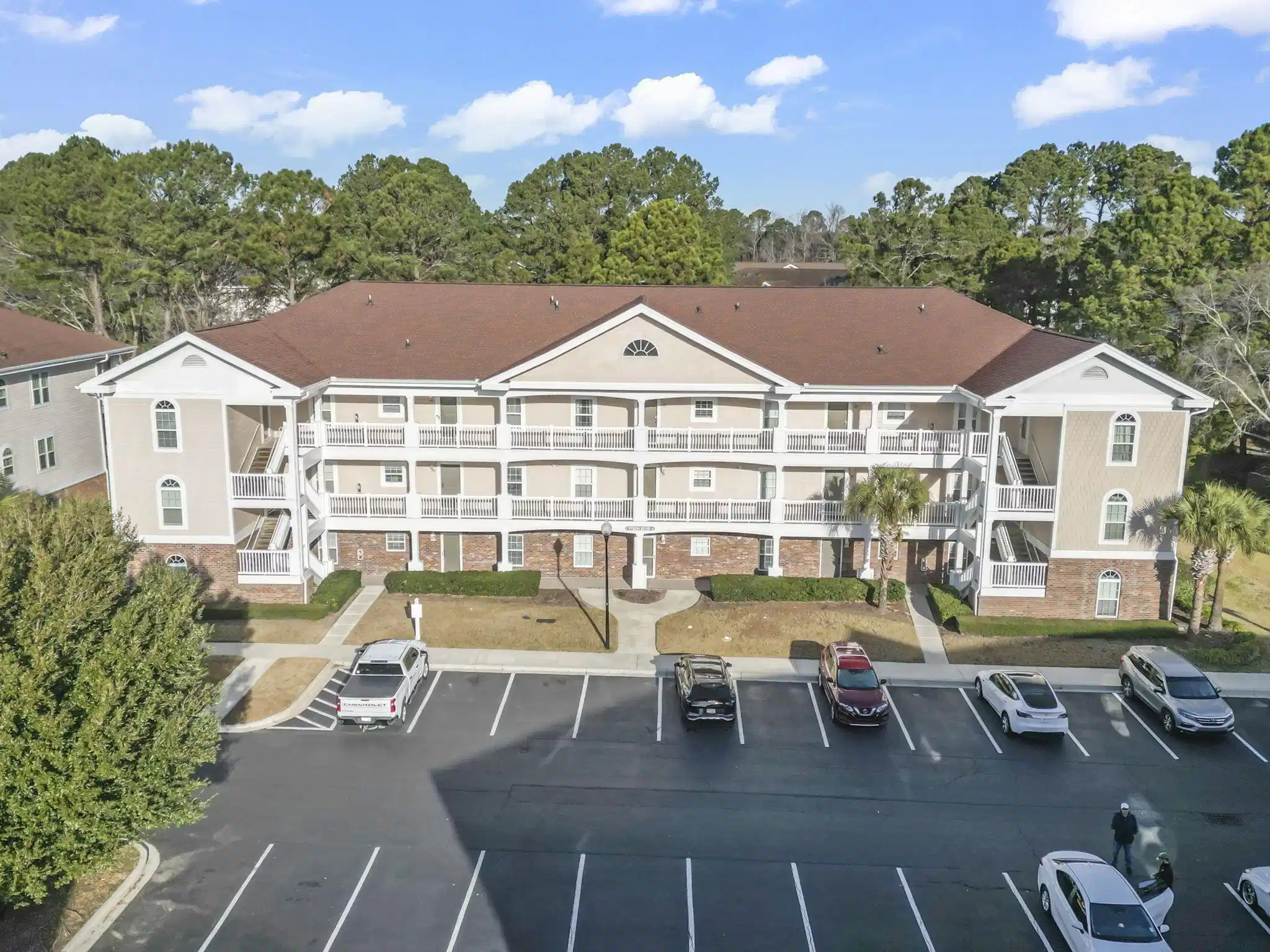 Image 1: View of apartment building / complex featuring unc Image 1: View of apartment building / complex featuring unc
