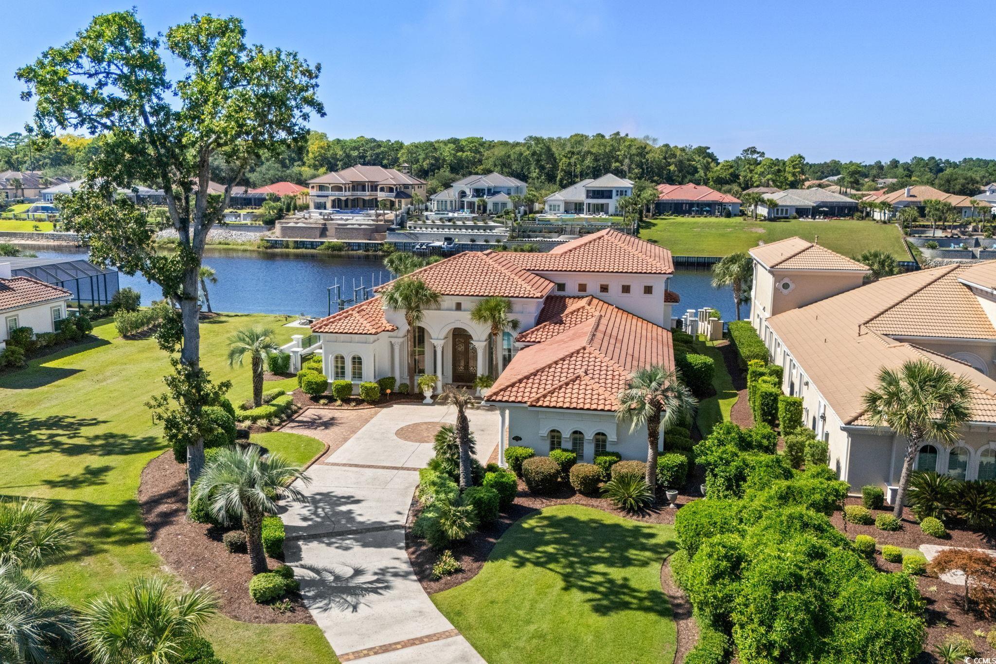 Image 3: Aerial view of residential area featuring a large