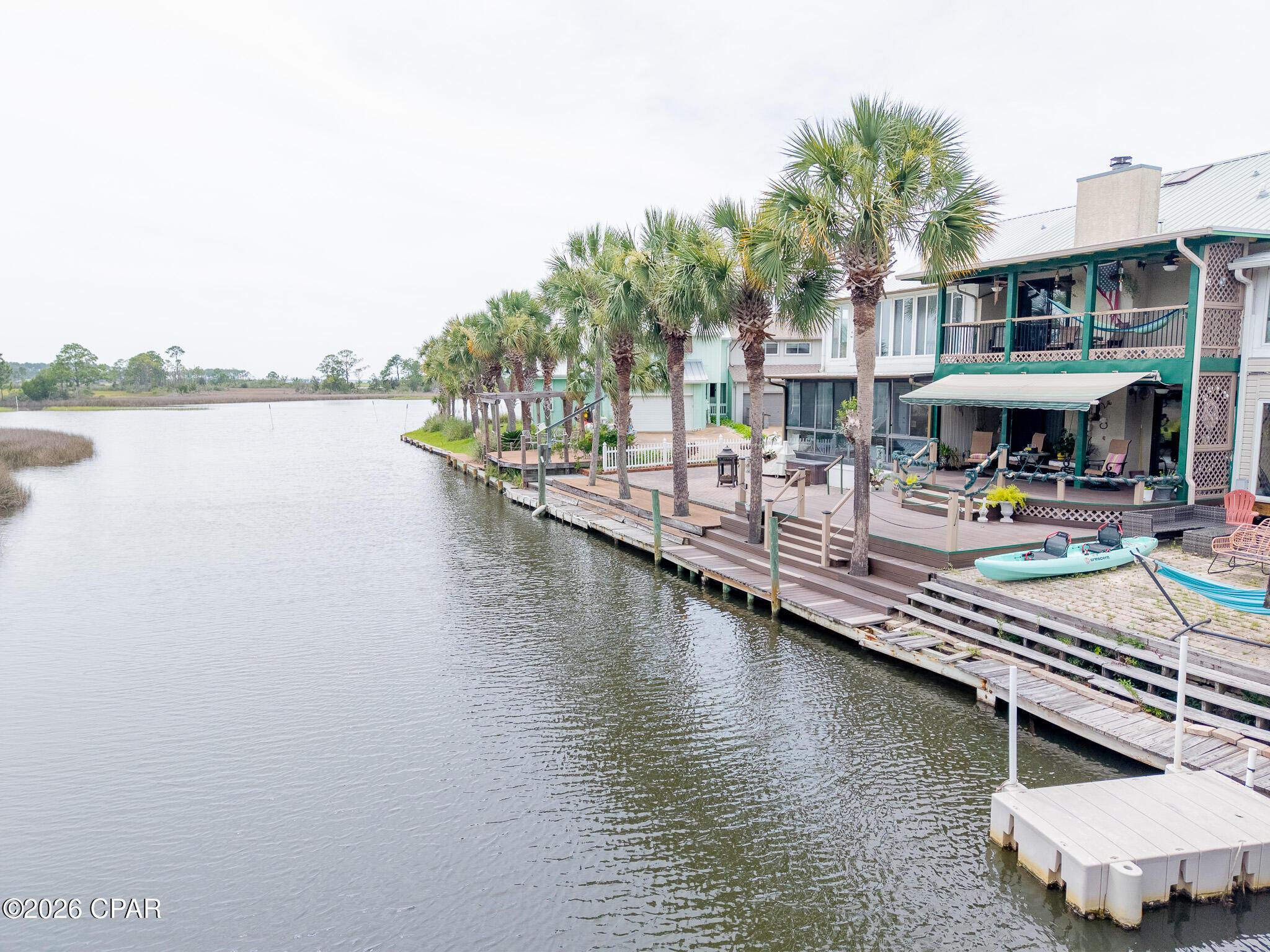 Image 3: 1227 Capri Dr Drone Canal & Porch 6-7-26