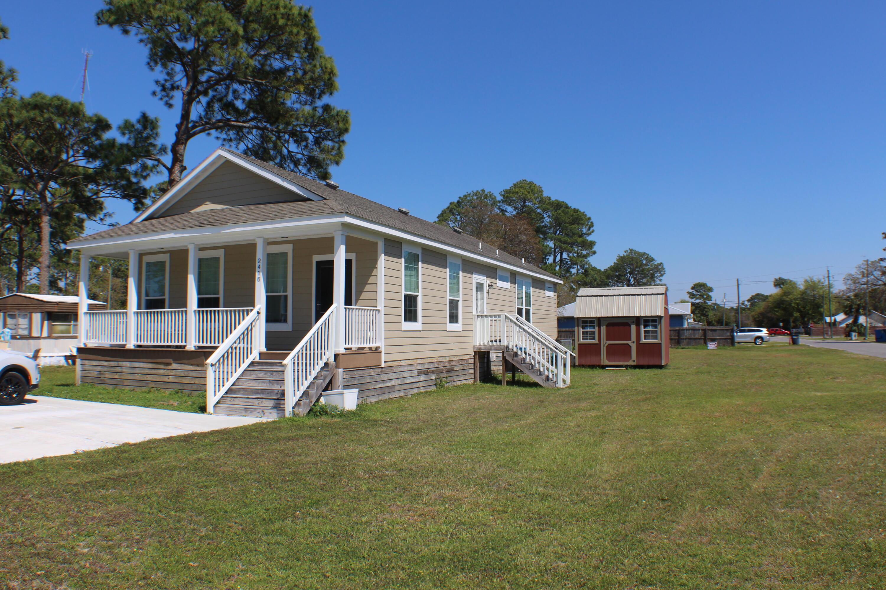 Image 2: Side of House with Shed