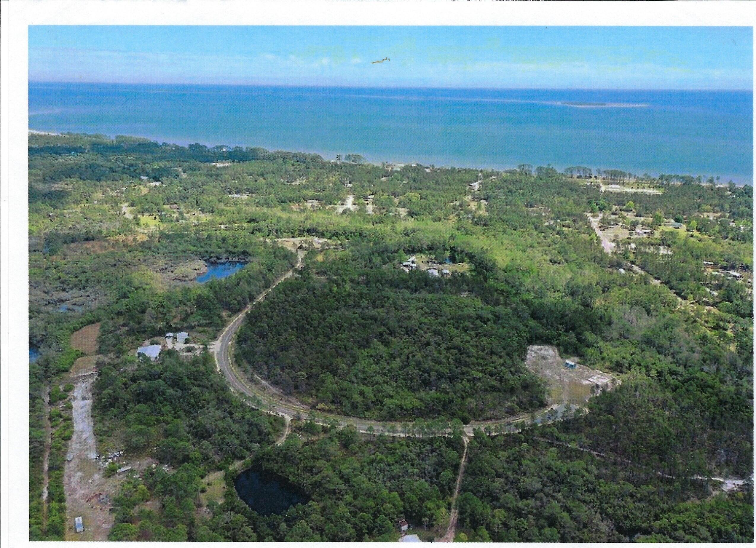 Image 1: Aerial view of Property and Gulf
