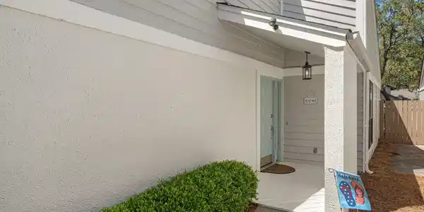 Image 4: Side entrance and covered porch area