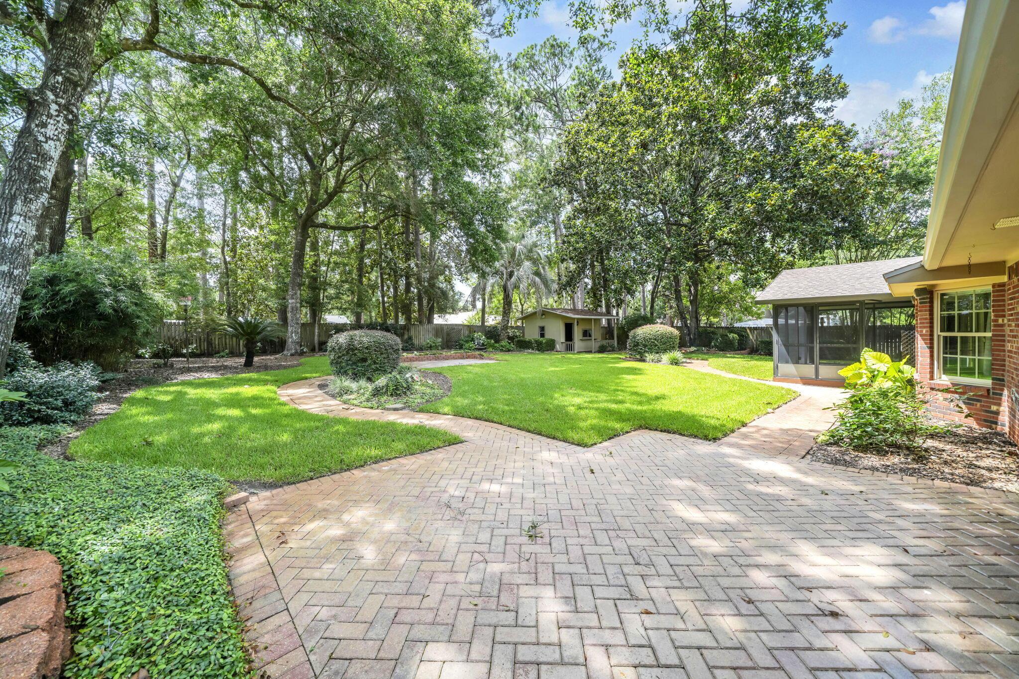 Image 2: Back yard with winding pathway