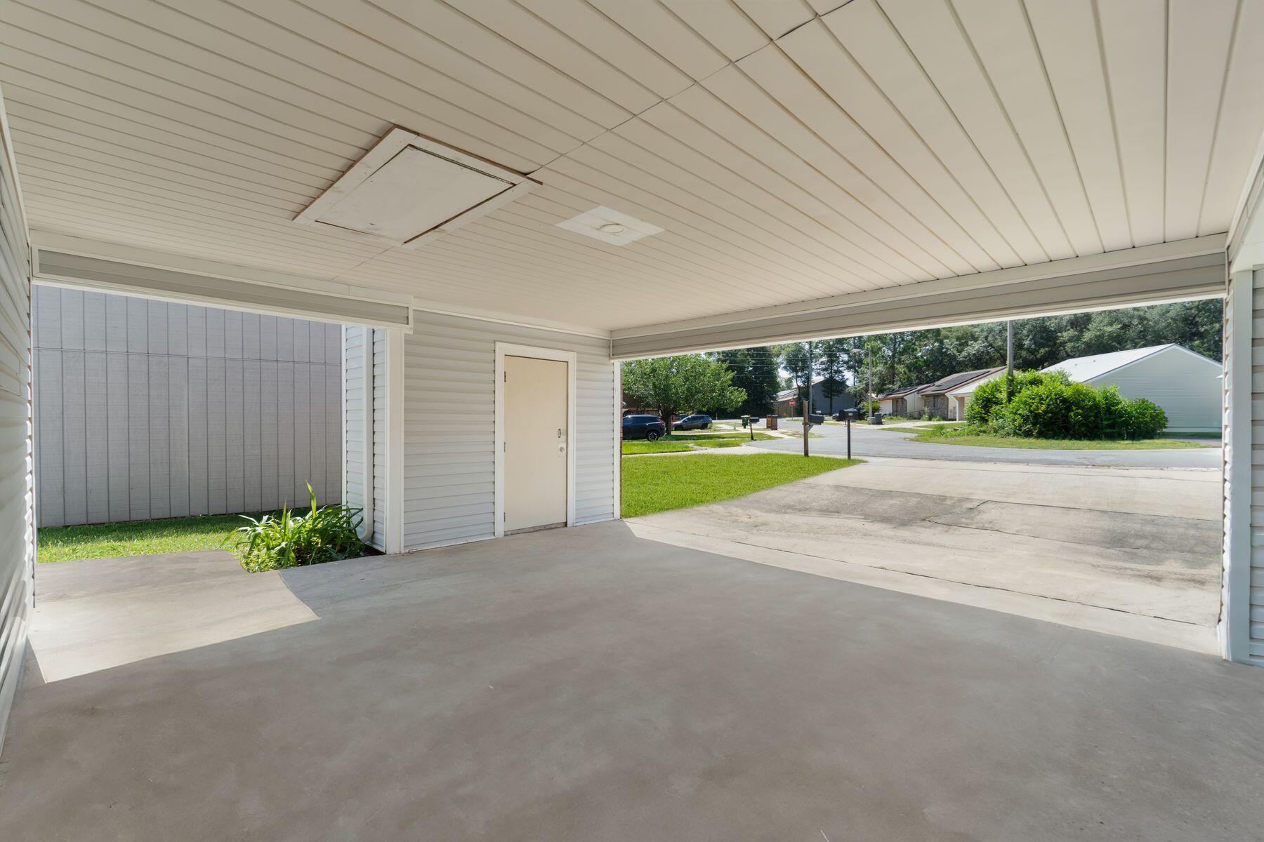 Image 3: Covered Parking w/ Storage Room