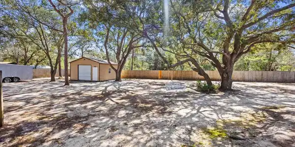 Image 4: Backyard with shop building