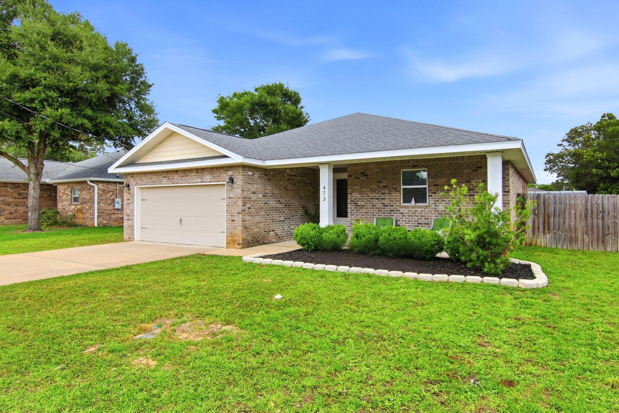 Image 3: Brick home with covered porch