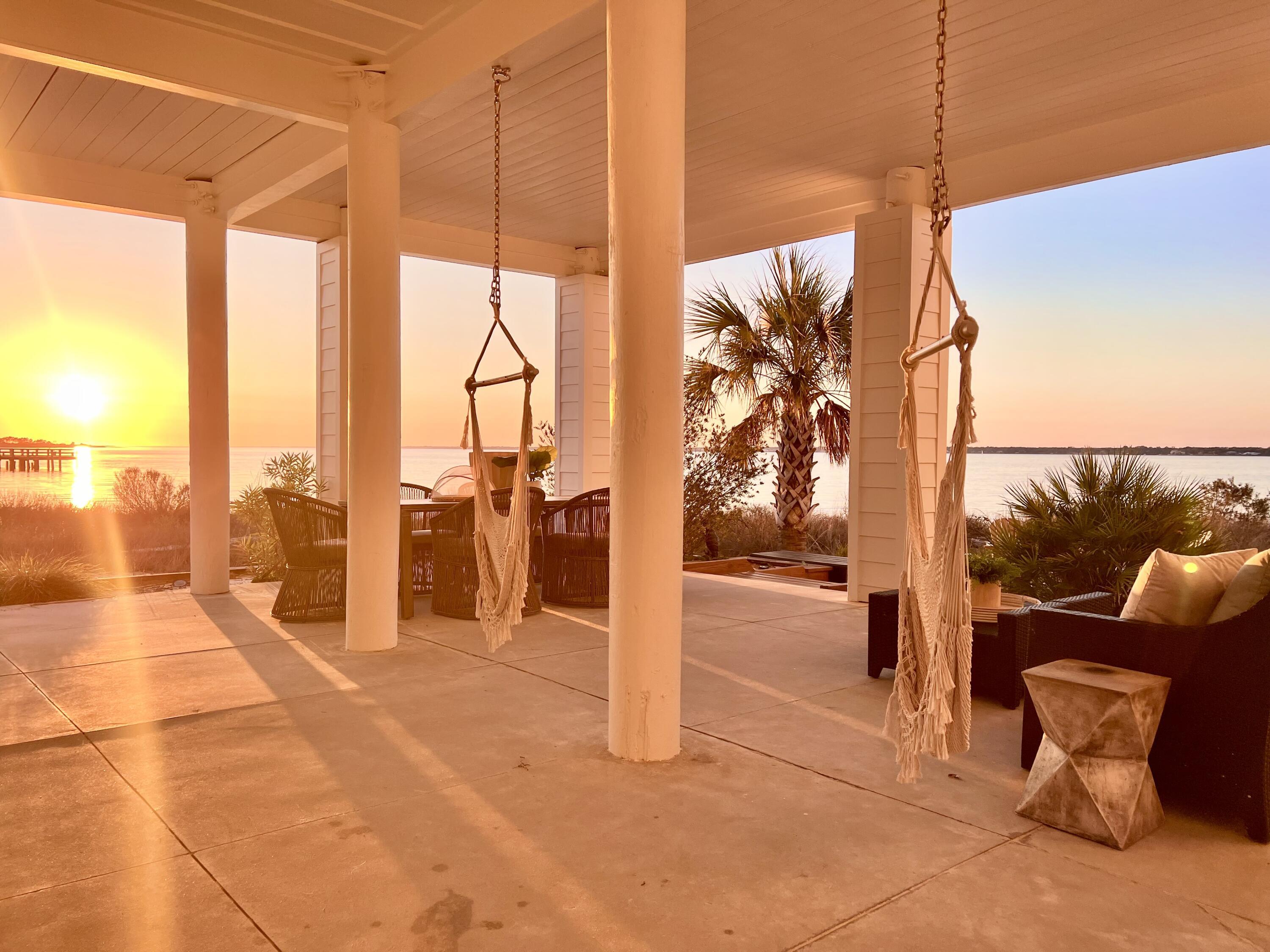 Image 1: back porch sunset over Sound