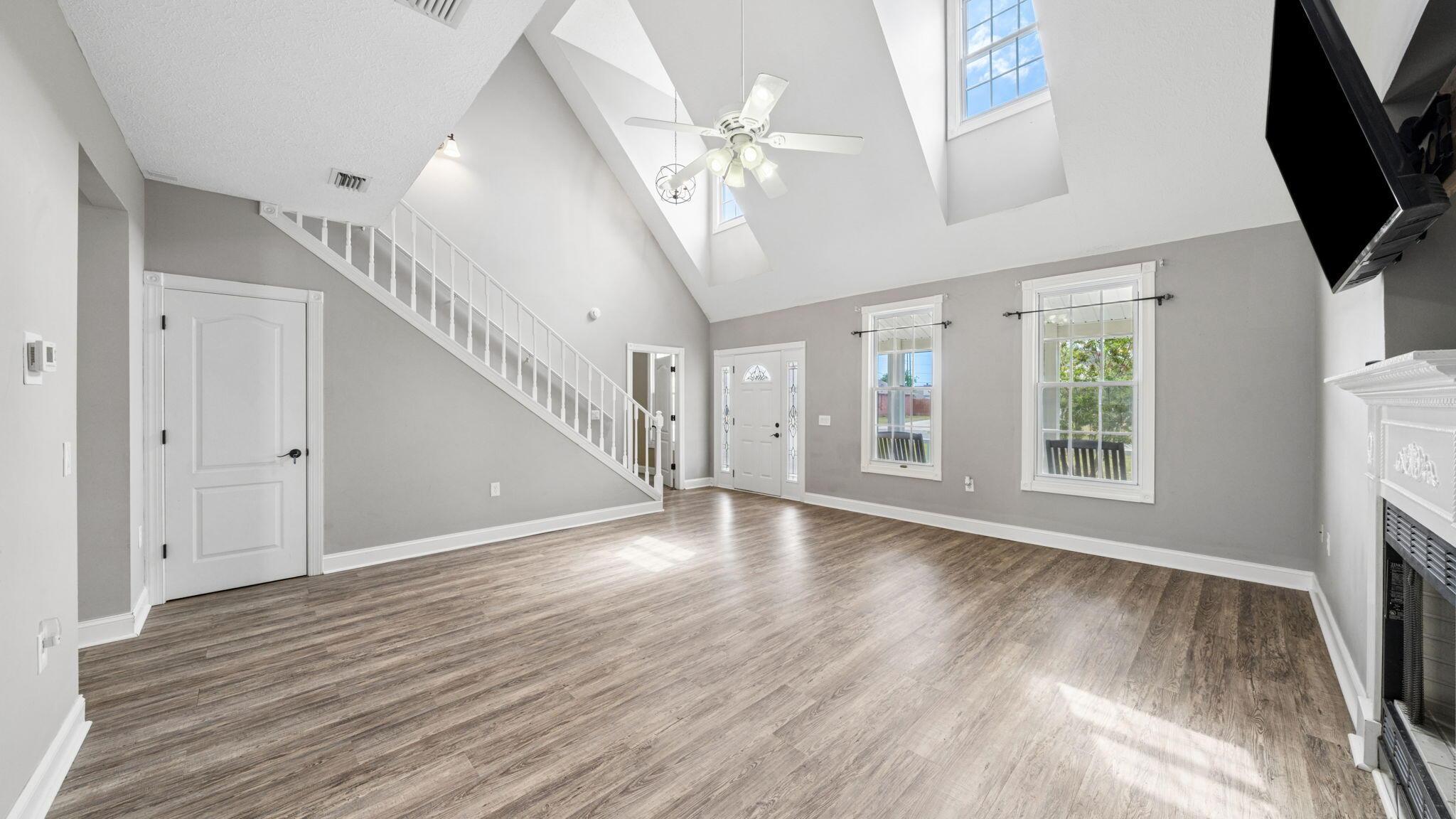 Image 3: Living room with a fireplace.