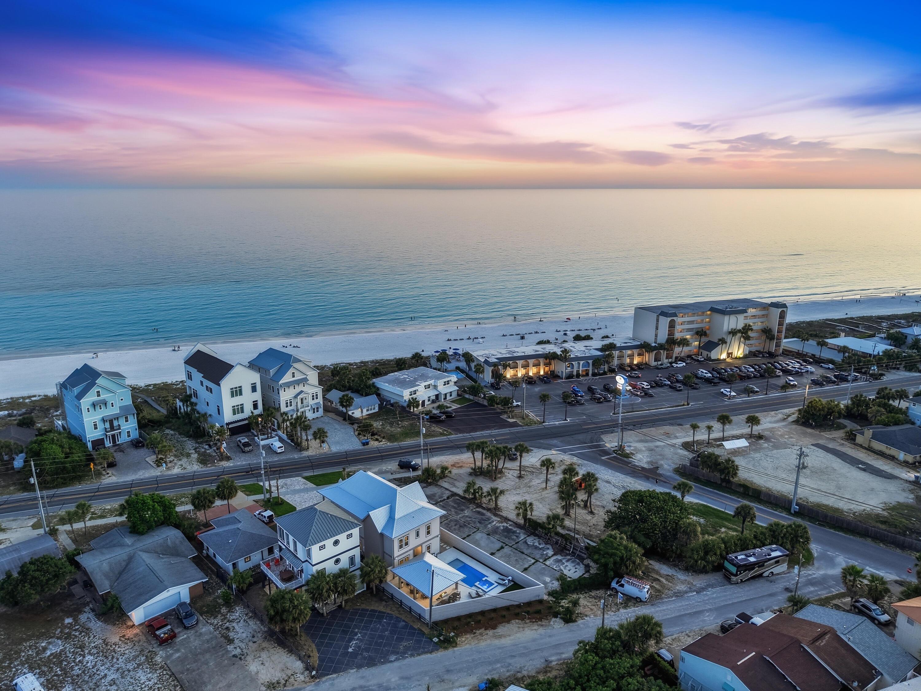 Image 3: 21814_front_beach_rd_twilight_drone-awp_
