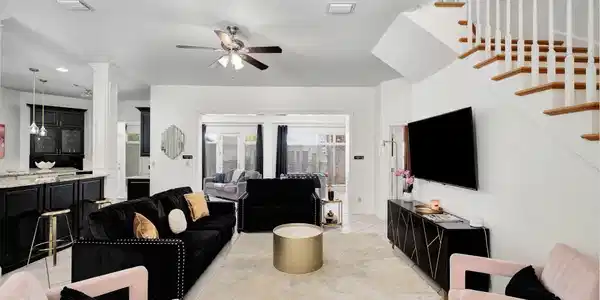 Image 3: Image #3 | Open living room with stairca