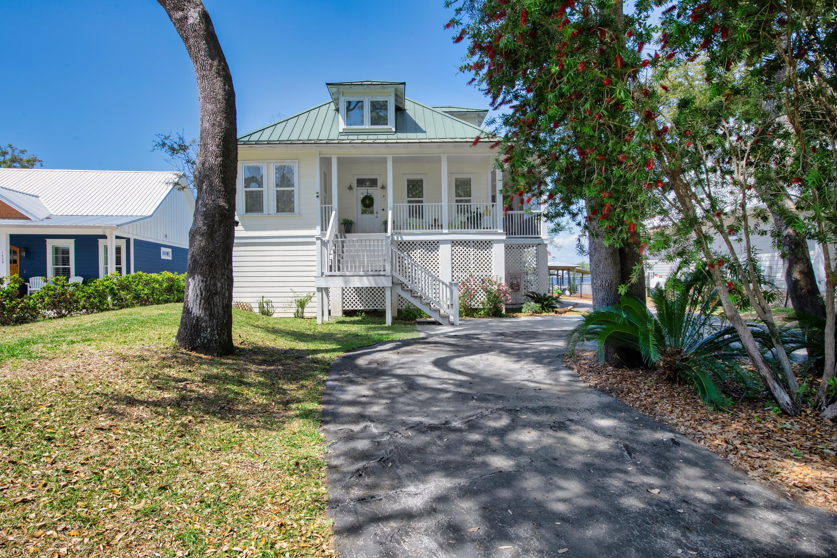 Image 1: driveway leading to home