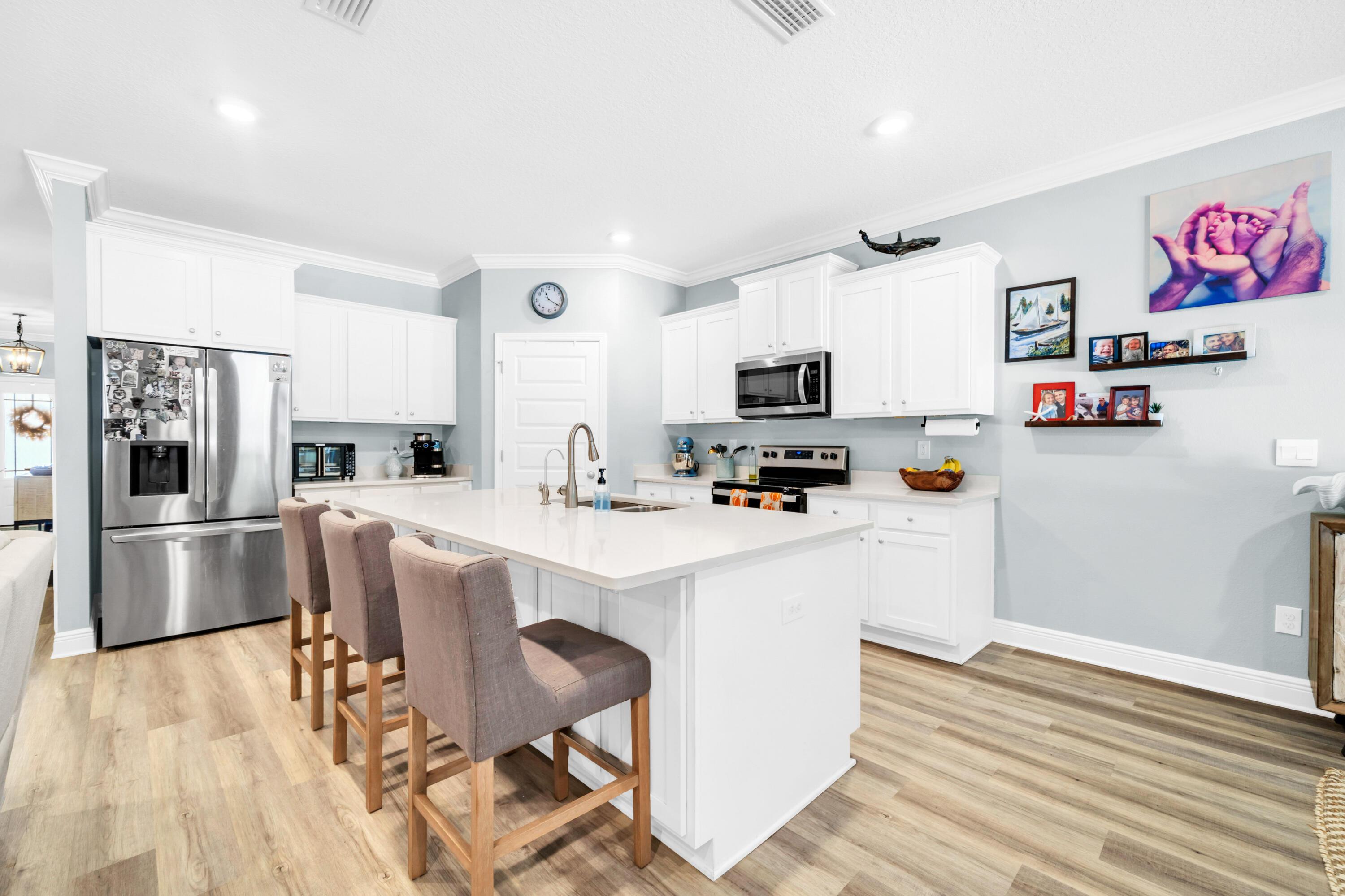 Image 2: White Cabinets and Island Seating