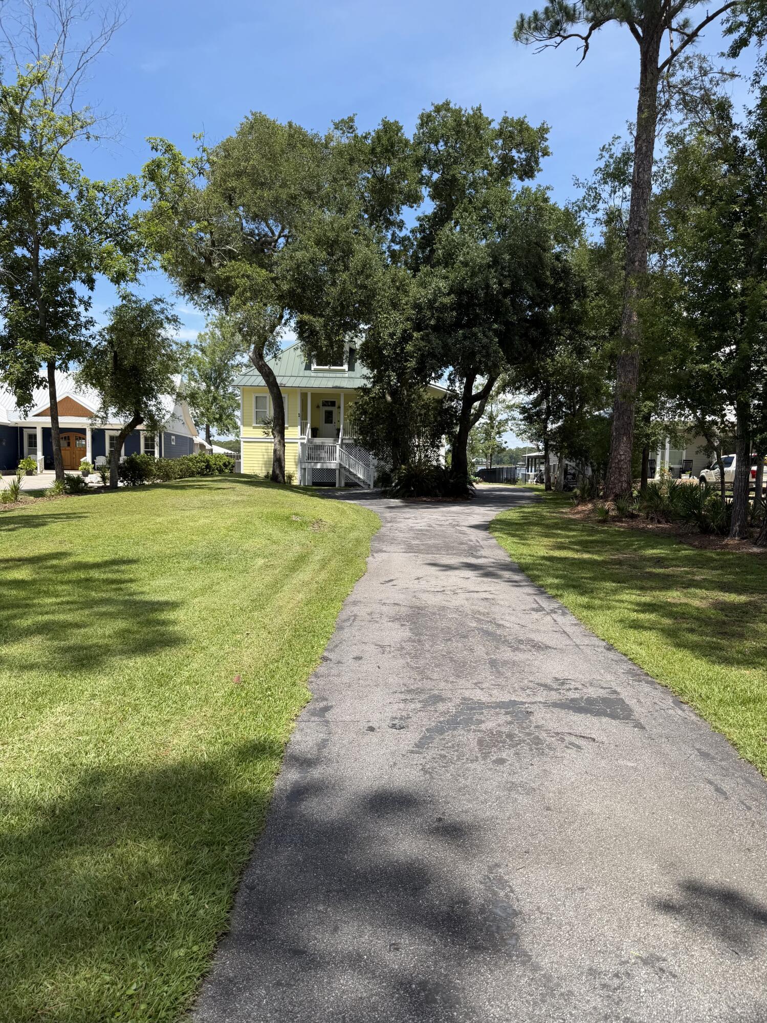 Image 3: driveway leading up to the home
