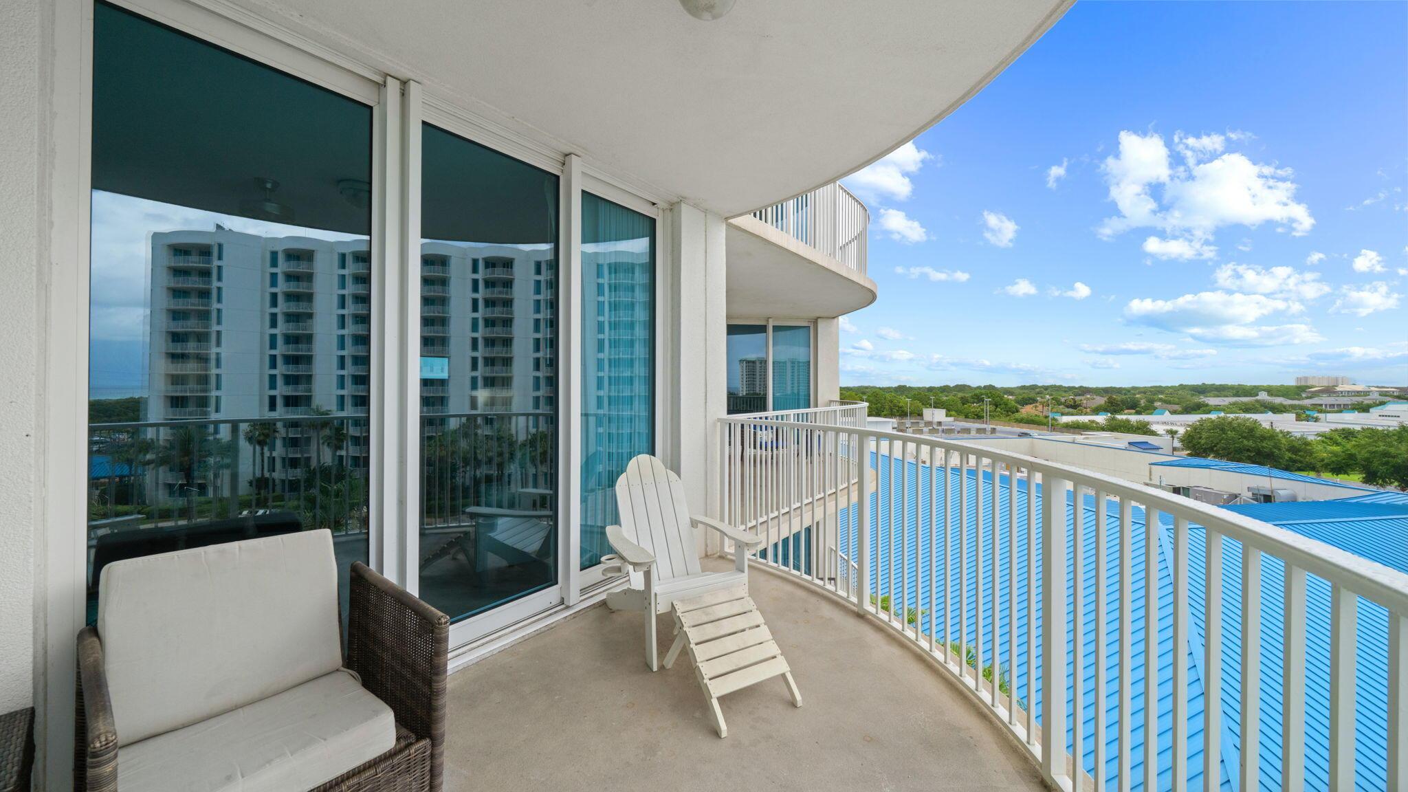 Image 2: Spacious balcony with resort views