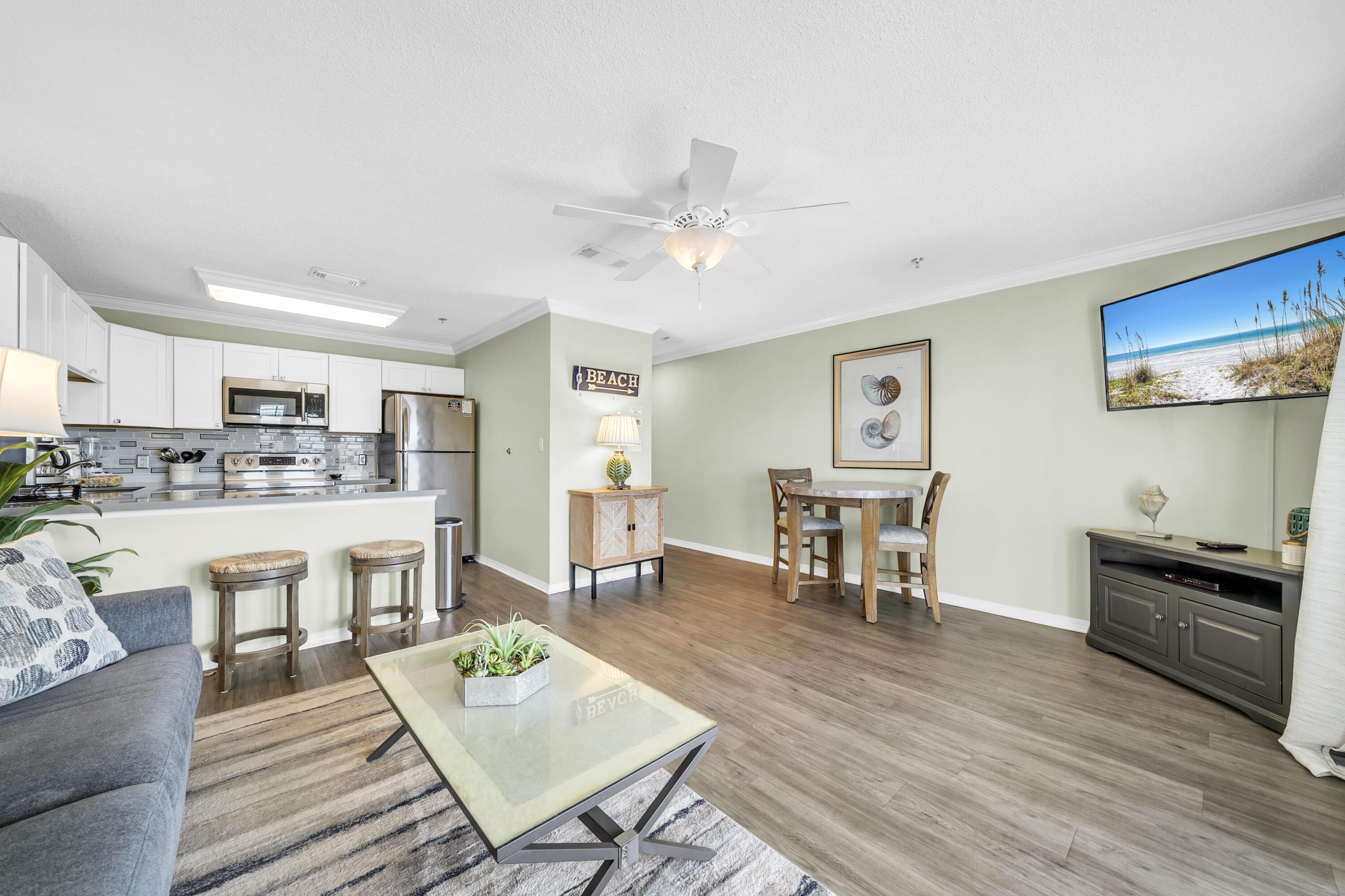 Image 3: Wide-open family room and kitchen