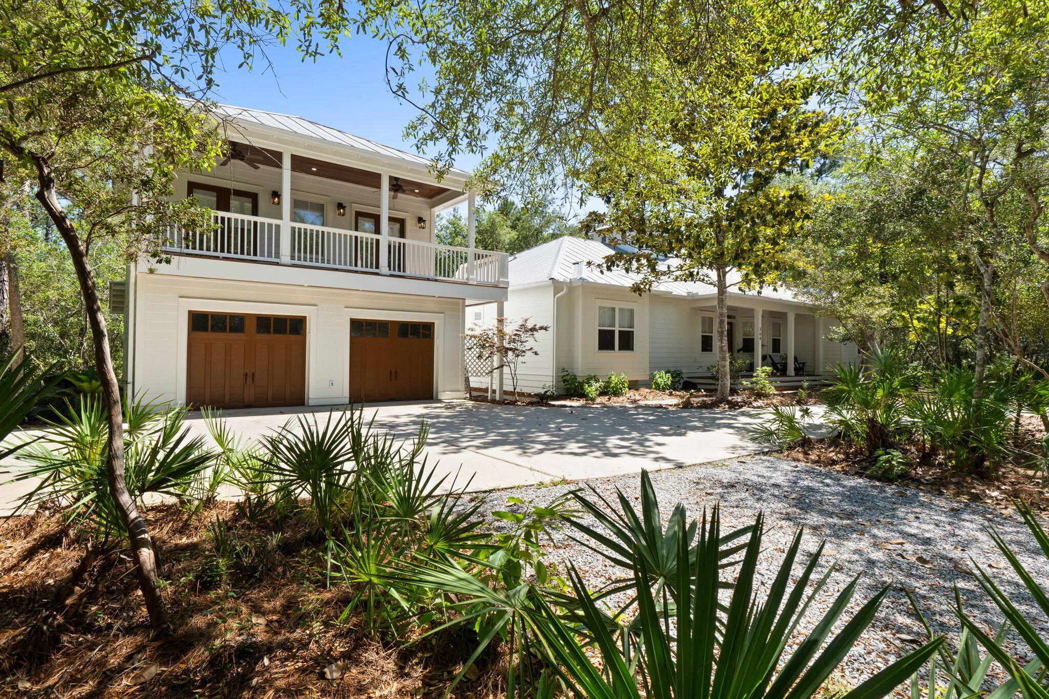 Image 1: Home + garage/carriage house