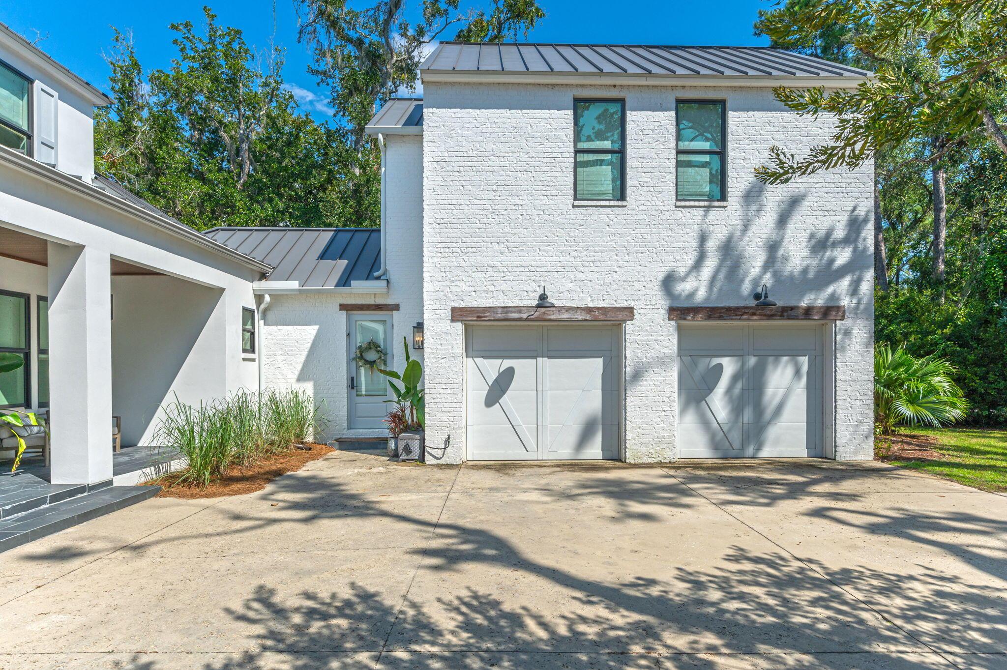 Image 3: 2 Car Garage with Attached Carriage