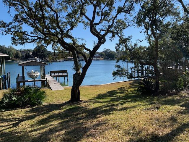 Image 1: Water with dock and boathouse
