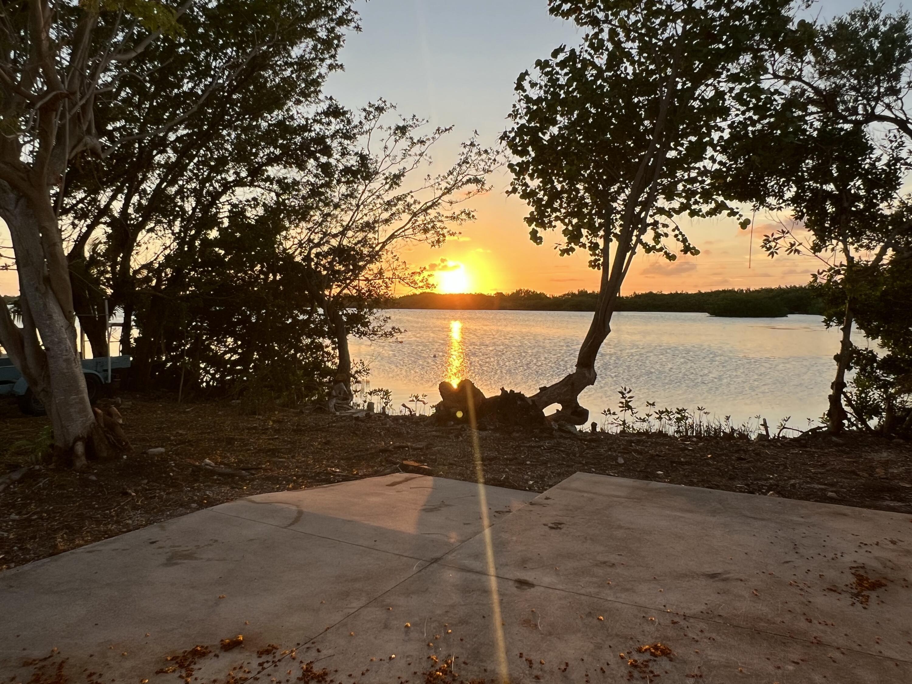 Image 1: Sunset Behind House