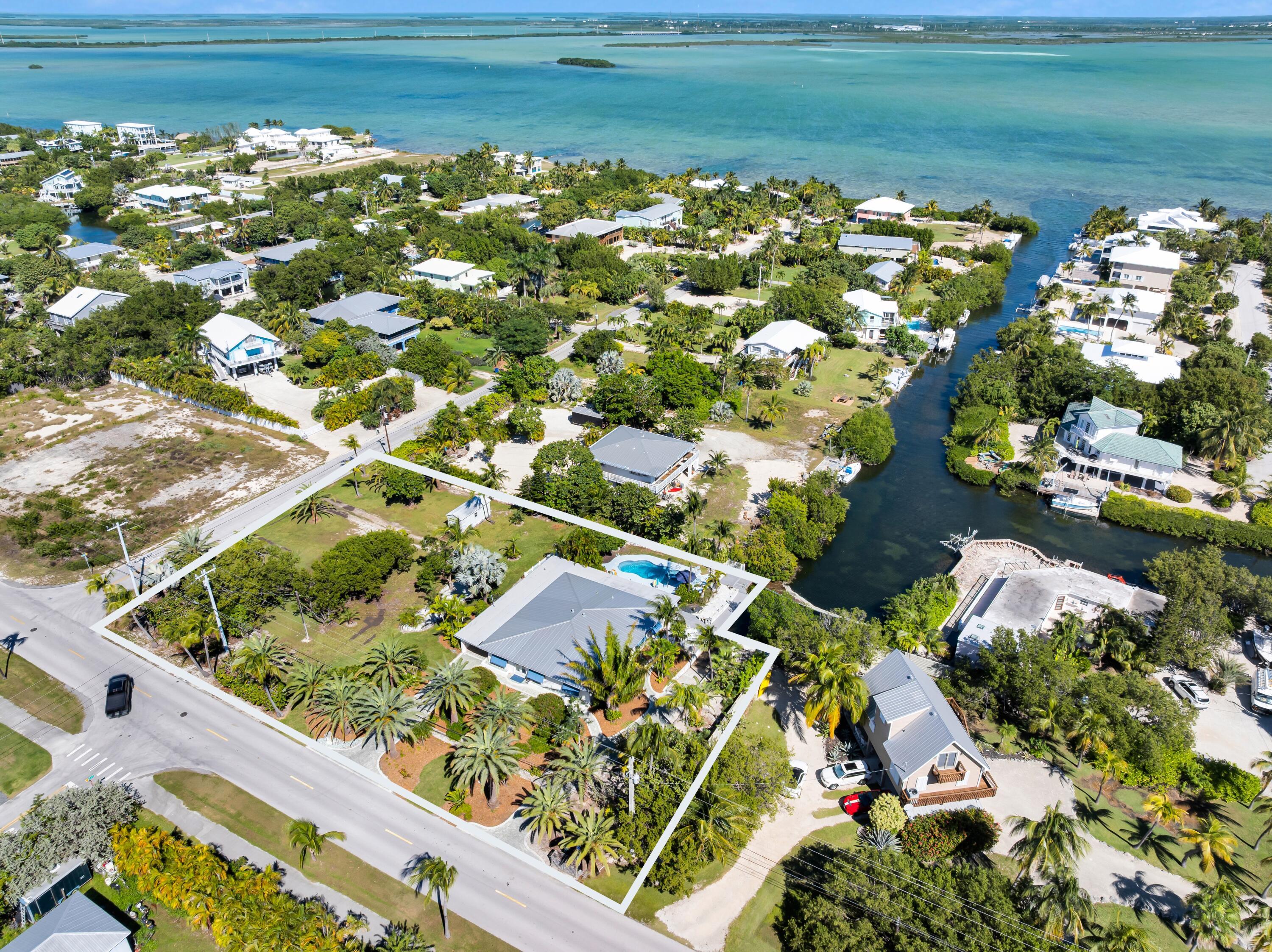 Image 1: Expansive canal lot