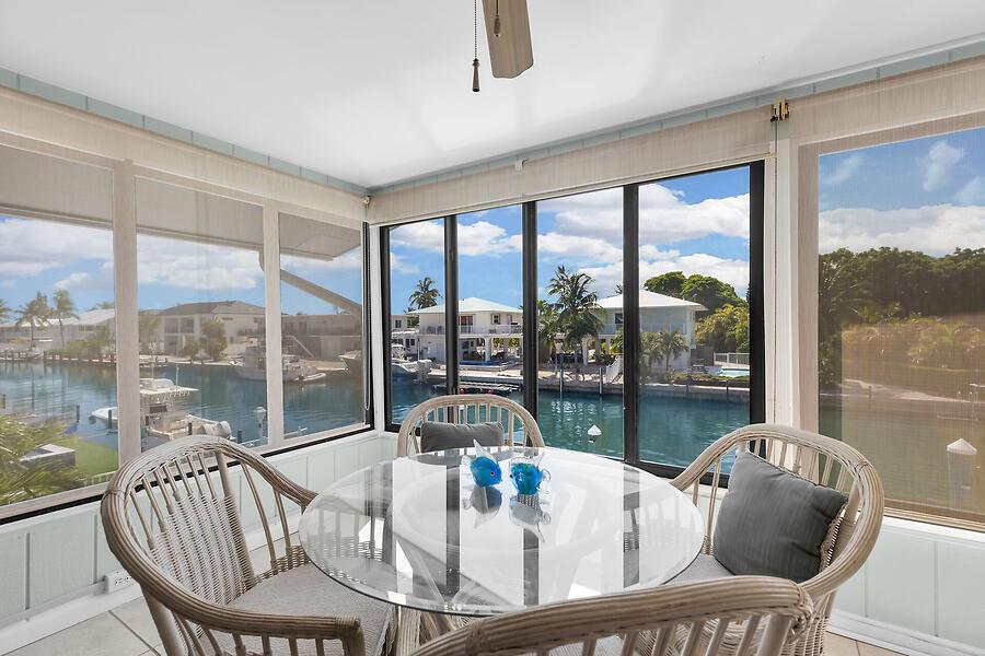 Image 3: Covered porch w/peaceful water views