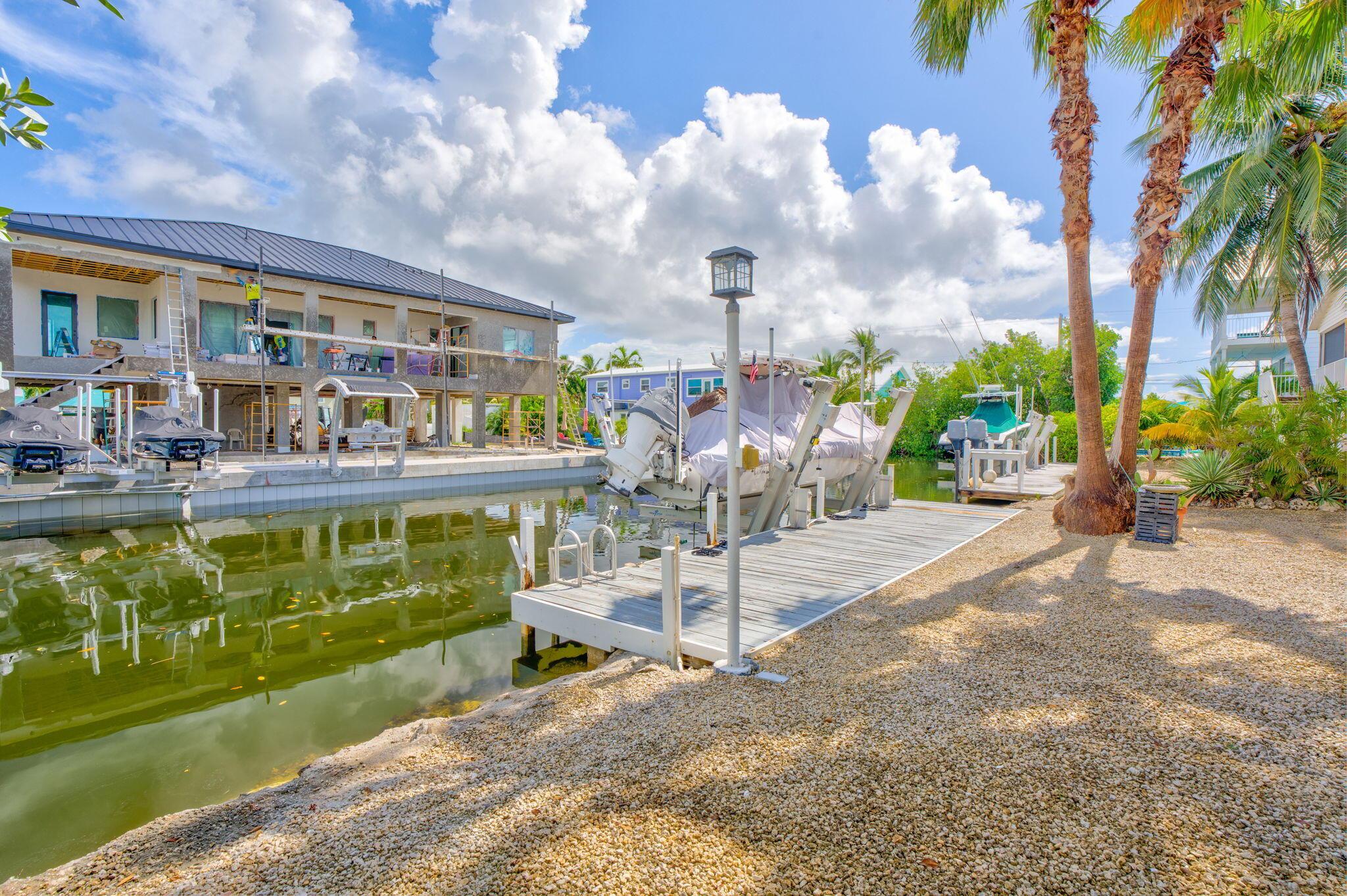 Image 2: Dock, Boat Lift, and Canal