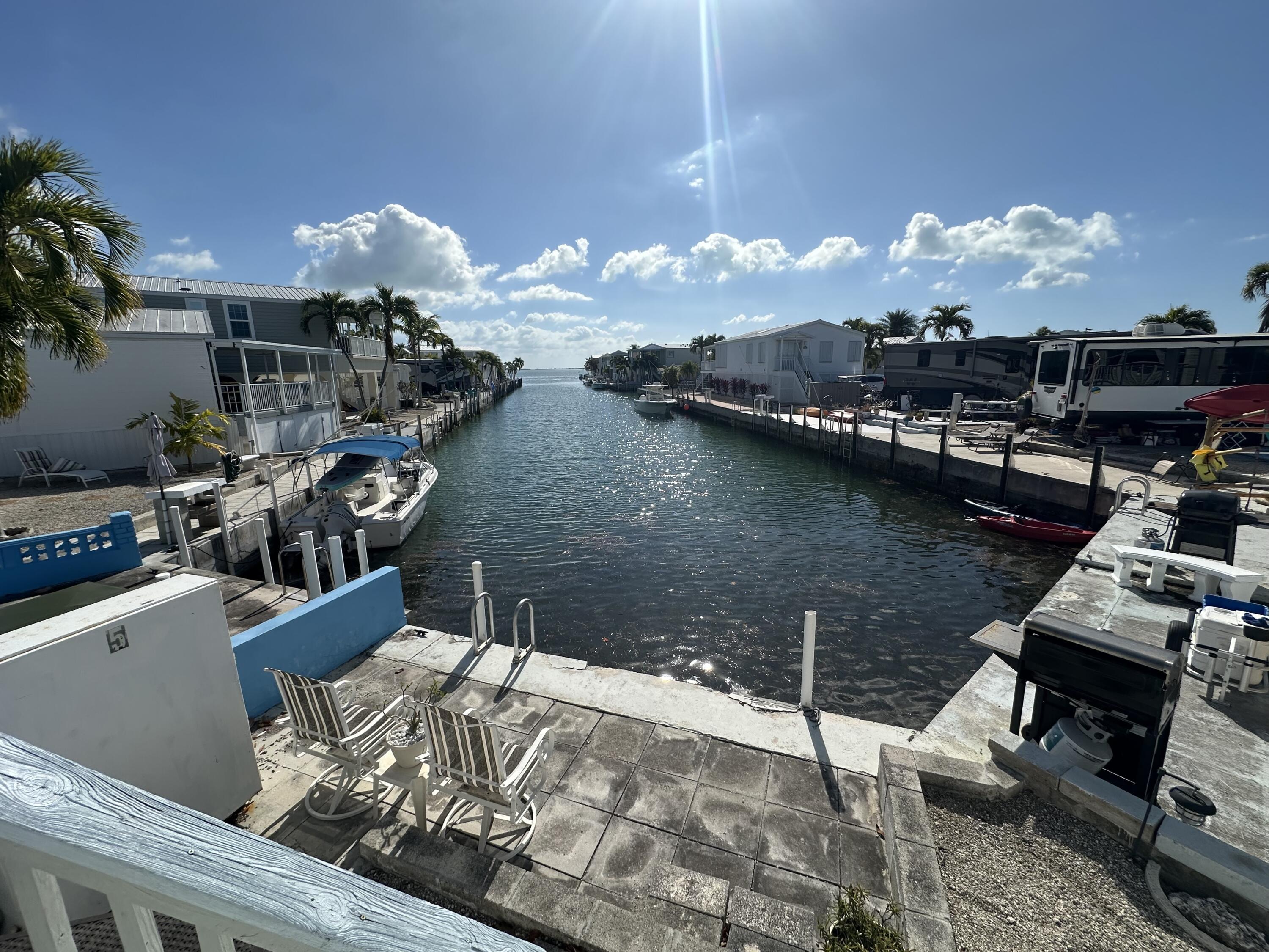 Image 2: Canal in back and back patio dock area