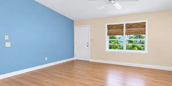Image 3: Bright Empty Room with Blue Accent Wall