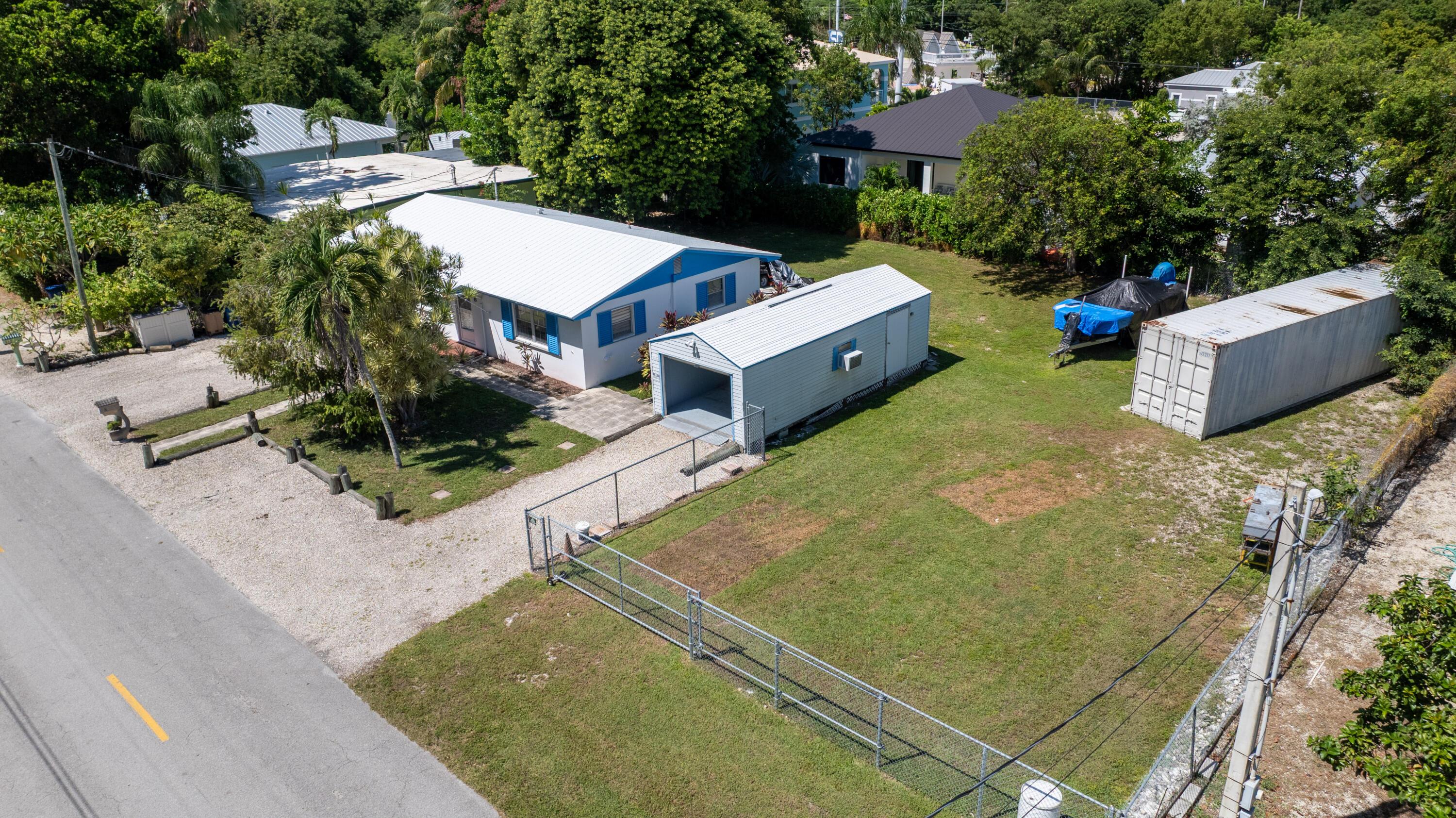 Image 1: CBS home on two lots