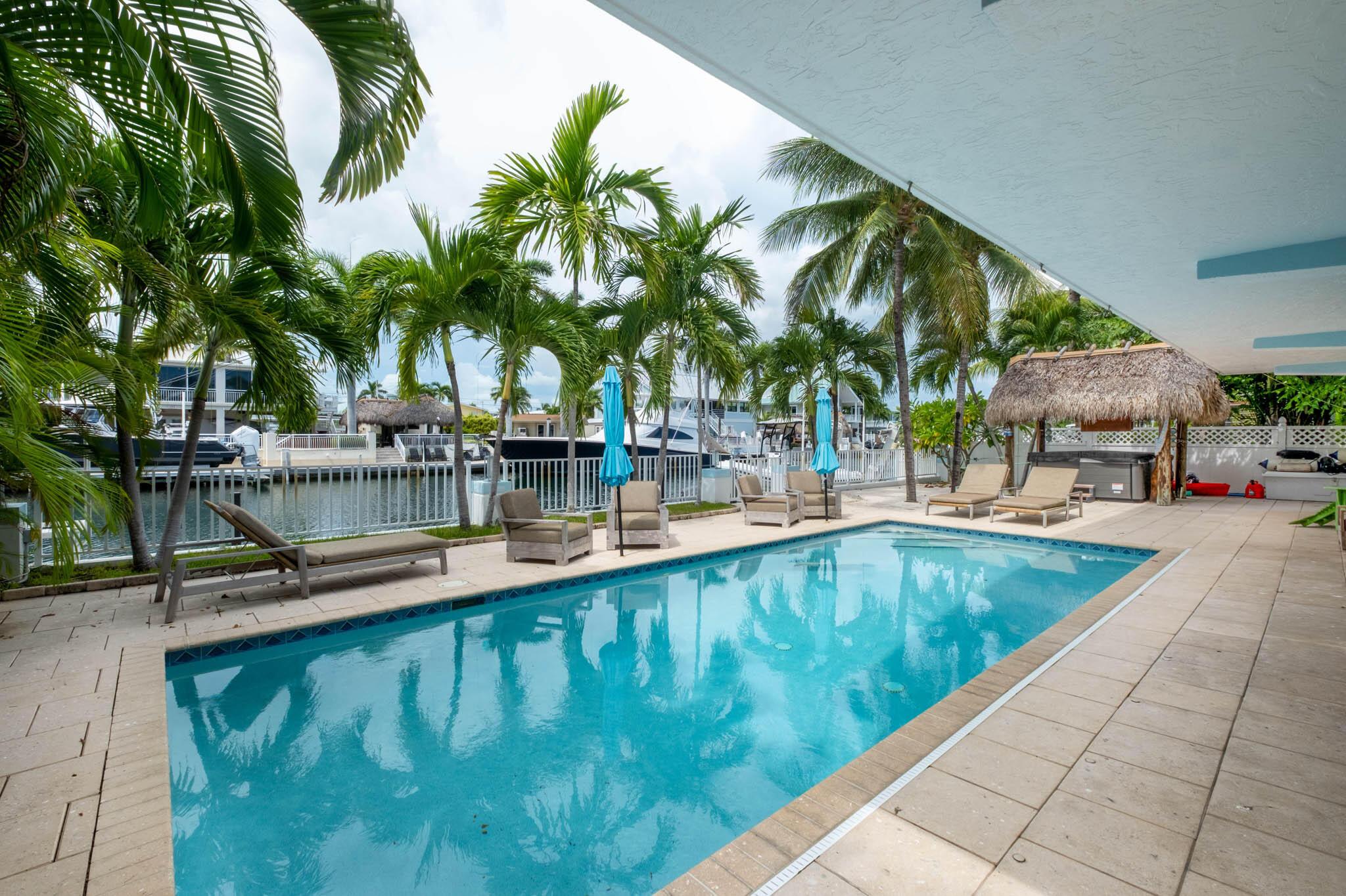 Image 2: Large pool and tiki