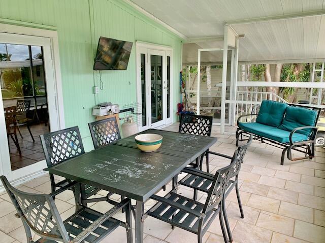 Image 3: FRONT SCREENED PORCH.