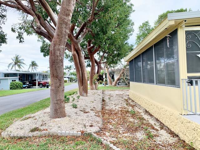 Image 4: NORTH SIDE VIEW OF HOME