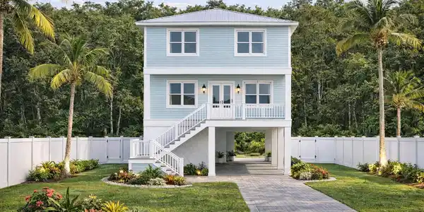 Image 2: Coastal house with tropical landscaping