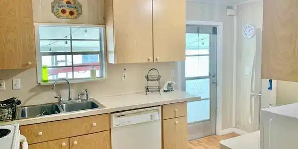 Image 3: KITCHEN WITH SIDE ENTRANCE TO HOME