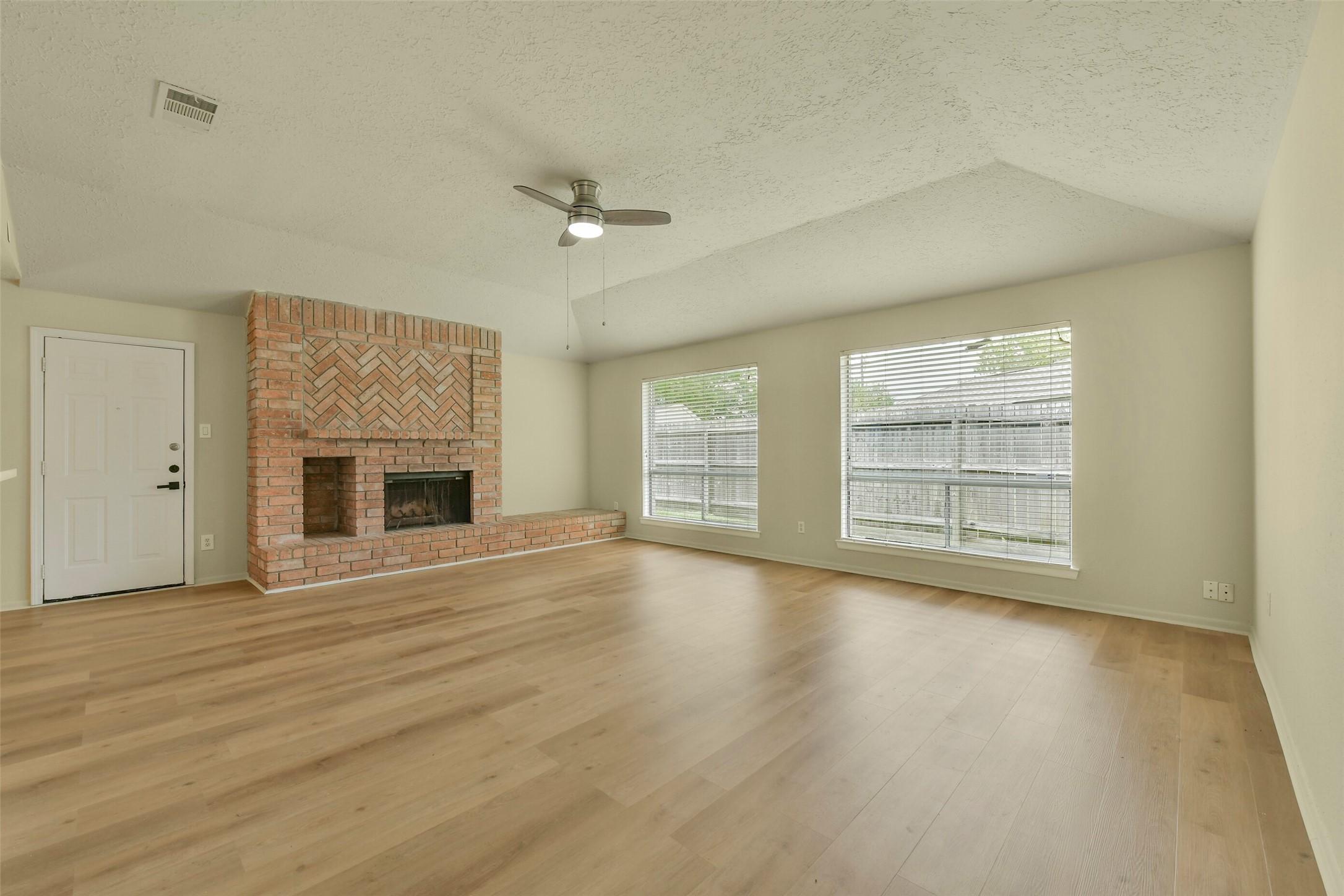 Image 2: This updated home offers a generously sized living