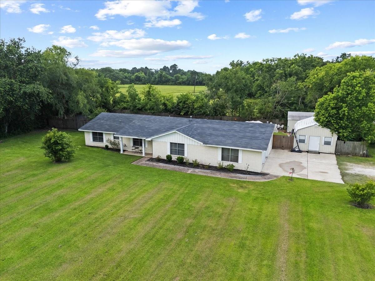 Image 3: This home sits on over an acre.