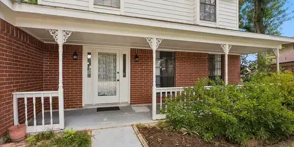 Image 4: Step onto the beautiful covered porch perfect for